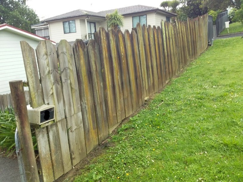 Damaged and weathered timber fence before repair, Auckland